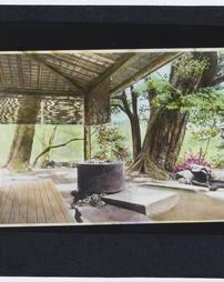 Japan. [Porch With stone water basin next to garden]