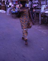 Woman walking through street market