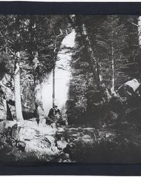 Spain. Unidentified. [Man seated in forest]