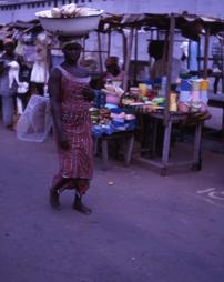 Woman walks through street market