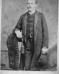 William S. Livengood posing with hat in hand