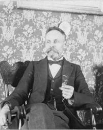 Cook family's father holding glasses