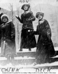 Female Students Poised to Throw Snowballs