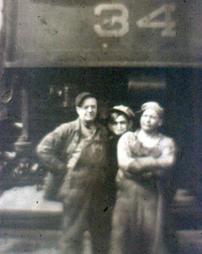 Three men in front of Engine 34