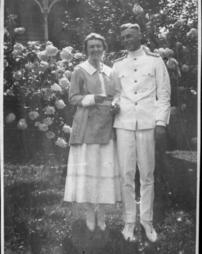 Frances and gentleman in a flower garden