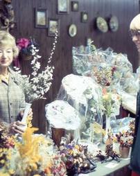 Woman Selling Dried Floral Arrangements at Maple Festival