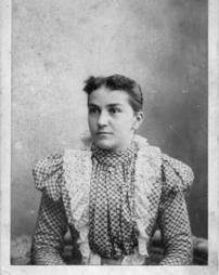 Woman with high collared checkered dress