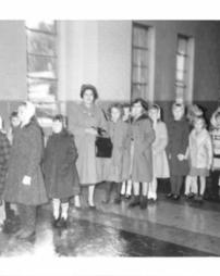 Women and children standing in line