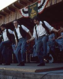 Male Cloggers Perform on Stage