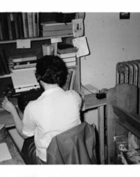 E. Gormish at typewriter, 1961