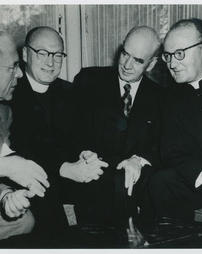 Monsignor Charles Owen Rice Seated and Talking with a Group Photograph