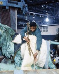 1996 Philadelphia Flower Show. Man with Chain Wrapping Dying Lioness