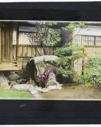 Japan. [Plantings outside a Japanese house]