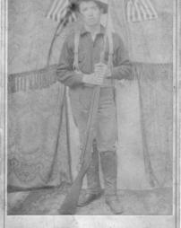 Howard J. Pyle in uniform, holding a long gun