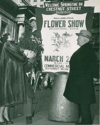 1950 Philadelphia Flower Show. Putting Up a Poster for the Flower Show