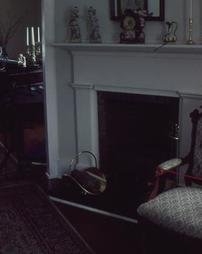 Upholstered Chair and Fireplace at Maple Manor