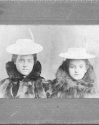 Two young ladies in fur coats and hats