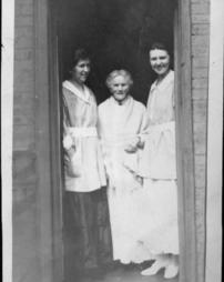 Mrs. Eisfeller and Louise in a doorway
