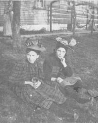 Emma Cook and Mary Weakland sitting in the grass