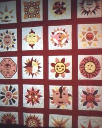 Hanging Sun-themed Applique Quilt with Red Borders