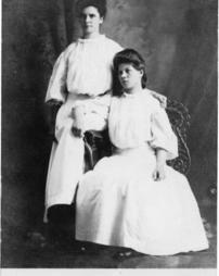 Two ladies in white dresses