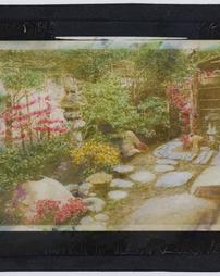 Japan. [Japanese garden detail showing path, stone placement and fence]