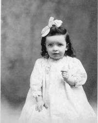 Young girl with white bow