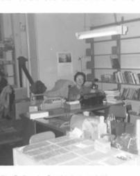 Joanne Holtz sitting at typewriting in a library