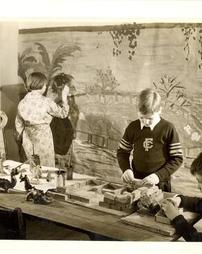 Students creating a dinosaur scene, 1928