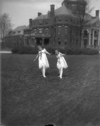 613, Play Cast Outside, Two Girls in Costume on Lawn, Flowers Around Head and Neck, Stockings on Legs, 8x10